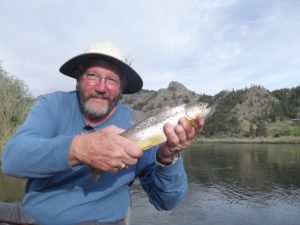 Fly Fisherman Holding A Brown Trout added to testimonials page