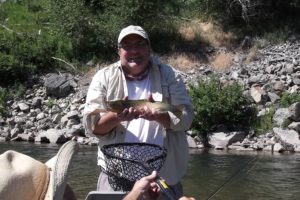 Fisherman with Blackfoot River Cutthroat on testimonials page