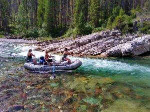 Man and 2 women in raft fishing on the South Fork Flathead River added to Contract and Agreement Forms page